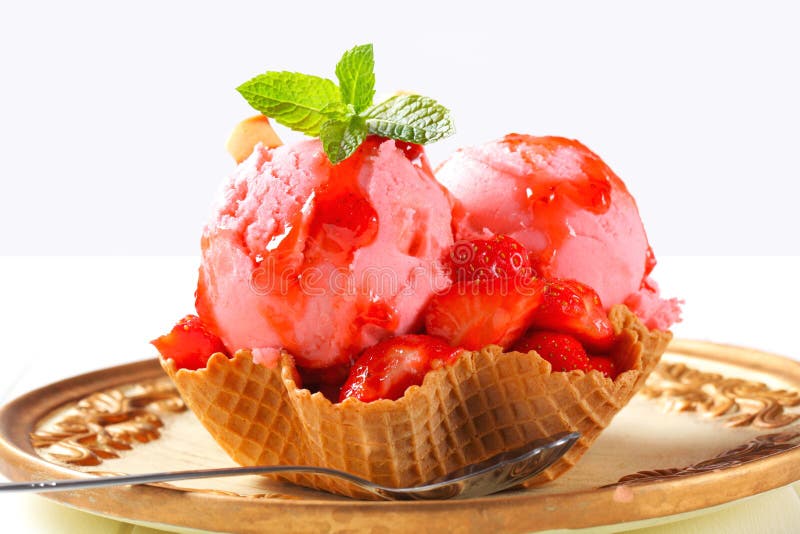 Ice cream with strawberries in wafer bowl