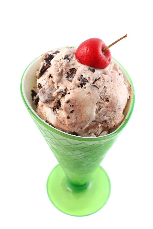 Vanilla ice cream with chocolate chunks in green sundae cup isolated on a white background. Vanilla ice cream with chocolate chunks in green sundae cup isolated on a white background