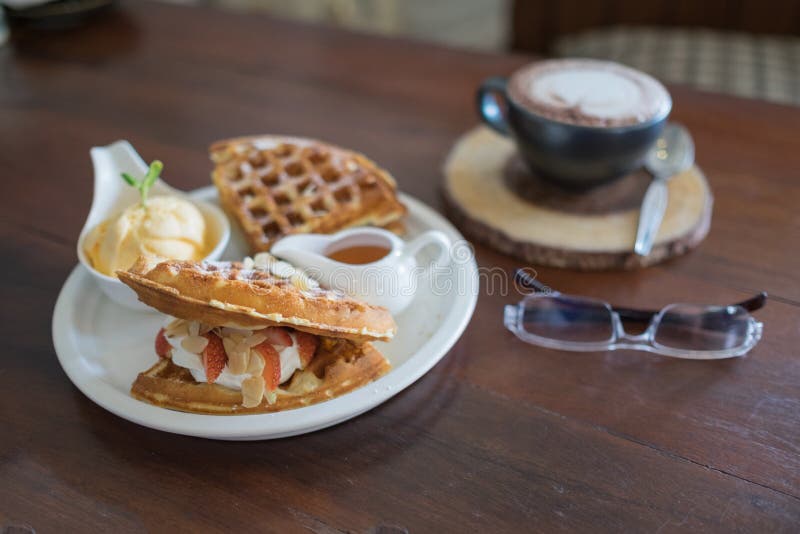 ice cream waffle strawberry waffle baked waffle fresh waffle hot coffee and glasses with waffle