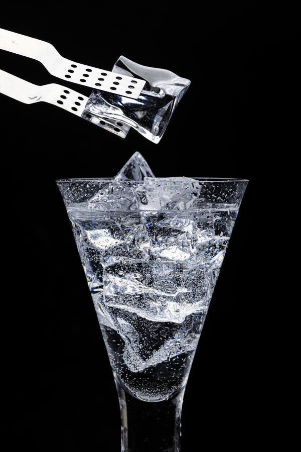 Big Ice Cube in Ice Tongs Over the Bucket Stock Photo - Image of water,  white: 154673844