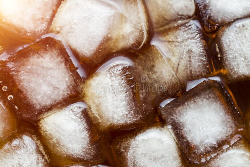 Ice cube with cola royalty free stock photography Ice cube with cola royalty free stock photography