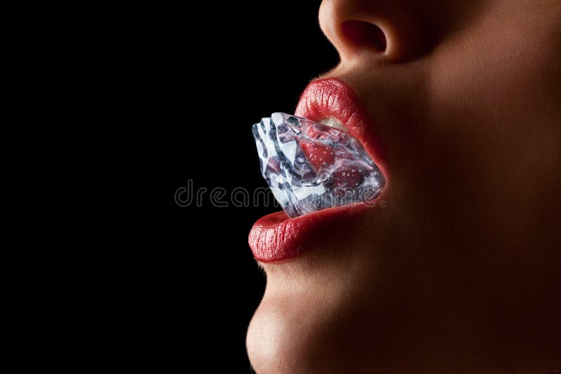 Ice cube in woman s mouth.