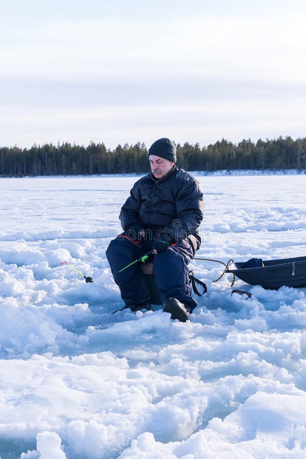 Ice Fishing. Fisherman Fishing on Frozen Lake. Winter Frosty Morning  Fishing on River. Vertical Photo Stock Photo - Image of sport, snow:  216997052