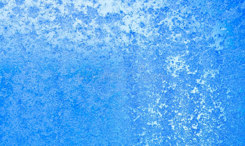 Ice flowers and frozen window macro view. Frost texture pattern. cold winter weather xmas background concept stock image Ice flowers and frozen window macro view. Frost texture pattern. cold winter weather xmas background concept stock image