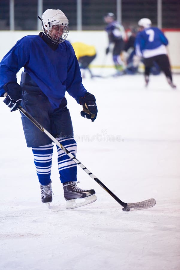 Ice hockey player in action. Isolated, background.