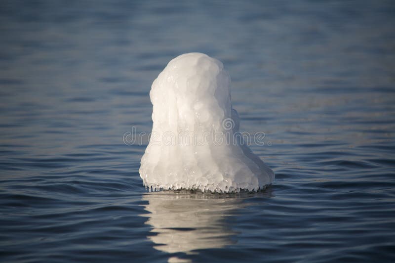 Ice on marker in water stock photo. Image of seashore - 12674440