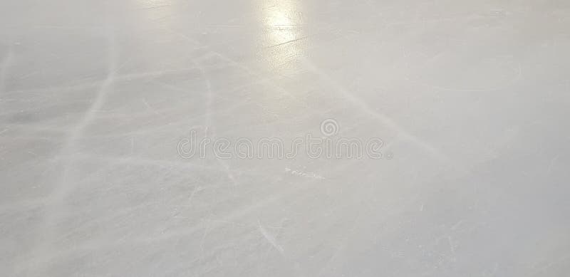 Ice rink floor surface background and texture in winter time