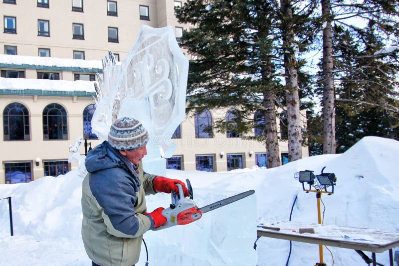 Ice Sculptor Carves Ice Block at Lake Louise in the Canadian Rockies