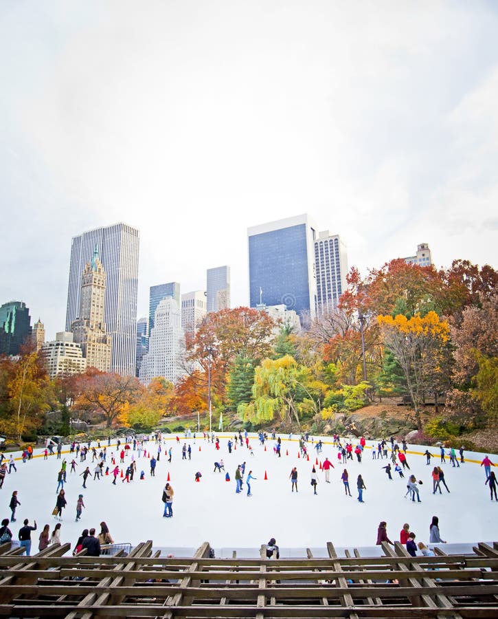 Ice skaters having fun in New York Central Park in fall