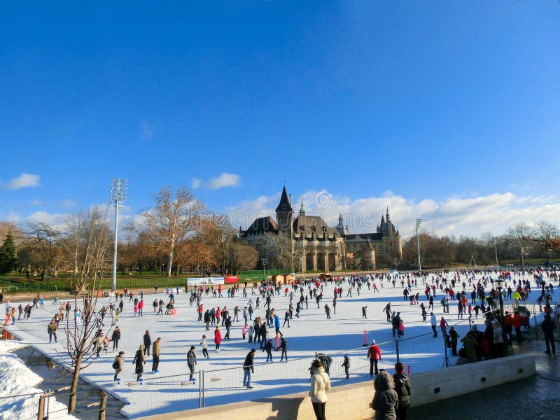 Ice skaters in City Park Rink in Budapest, Hungary. Ice skaters in City Park Ice Rink in Budapest, Hungary. Opened in 1870, it is the largest and one of the royalty free stock photography Ice skaters in City Park Rink in Budapest, Hungary. Ice skaters in City Park Ice Rink in Budapest, Hungary. Opened in 1870, it is the largest and one of the royalty free stock photography