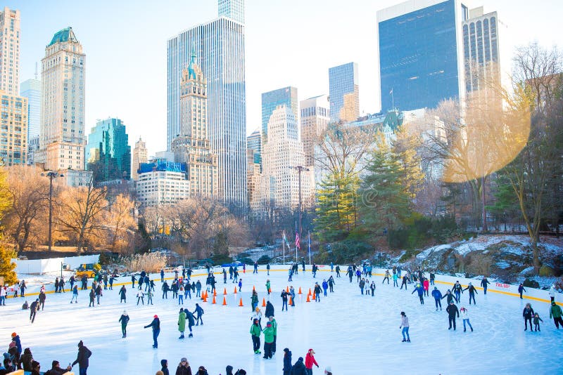 Ice skaters having fun in New York Central Park outdoor. Ice skaters having fun in New York Central Park outdoor