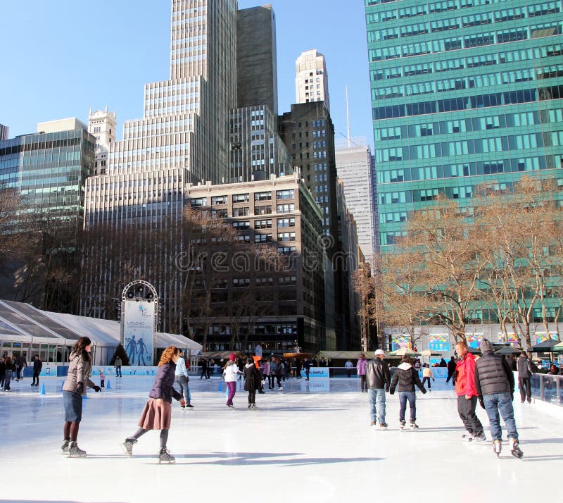 Skaters enjoying a beautiful day at Bryant Park's ice rink in Manhattan,NY. Skaters enjoying a beautiful day at Bryant Park's ice rink in Manhattan,NY.