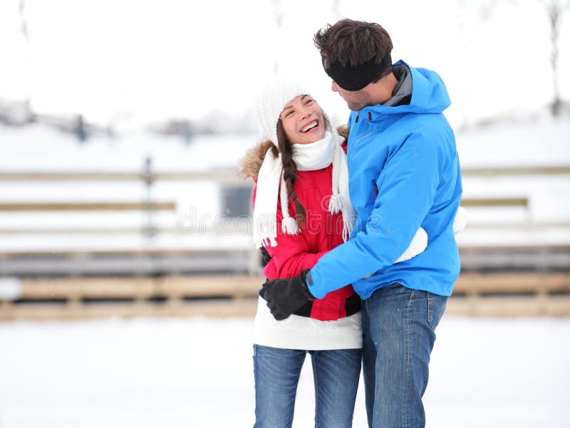 Ice skating romantic couple on date iceskating