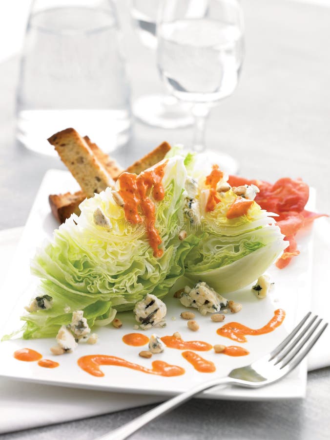 Iceberg Wedge with Blue Cheese, Roasted Red Pepper Dressing Stock Image