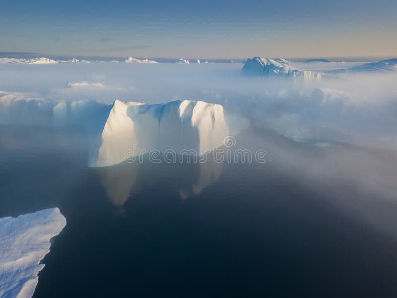 Icebergs drone aerial image top view - Climate Change and Global Warming. Icebergs from melting glacier in icefjord in Ilulissat. royalty free stock photos Icebergs drone aerial image top view - Climate Change and Global Warming. Icebergs from melting glacier in icefjord in Ilulissat. royalty free stock photos