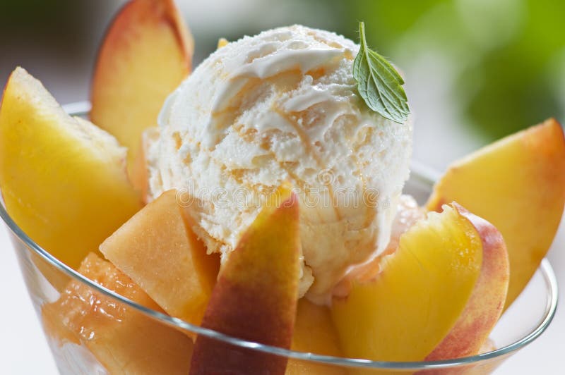 Refreshing peach ice cream in a glass close up. Refreshing peach ice cream in a glass close up