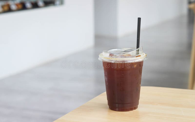 https://thumbs.dreamstime.com/b/iced-black-tasty-coffee-plastic-cup-straw-wooden-table-shop-beverage-break-refreshment-morning-lunch-239019619.jpg