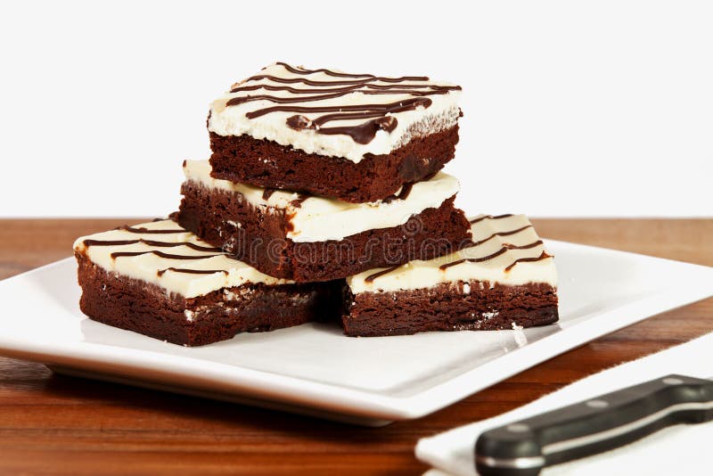Iced Brownies on a plate stock image. Image of cookery 17474681
