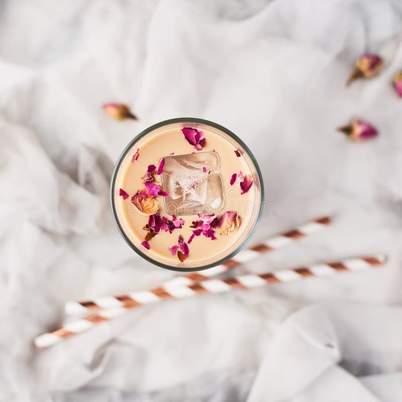 Iced coffee with rose and cardamom in a tall glass royalty free stock photo Iced coffee with rose and cardamom in a tall glass royalty free stock photo