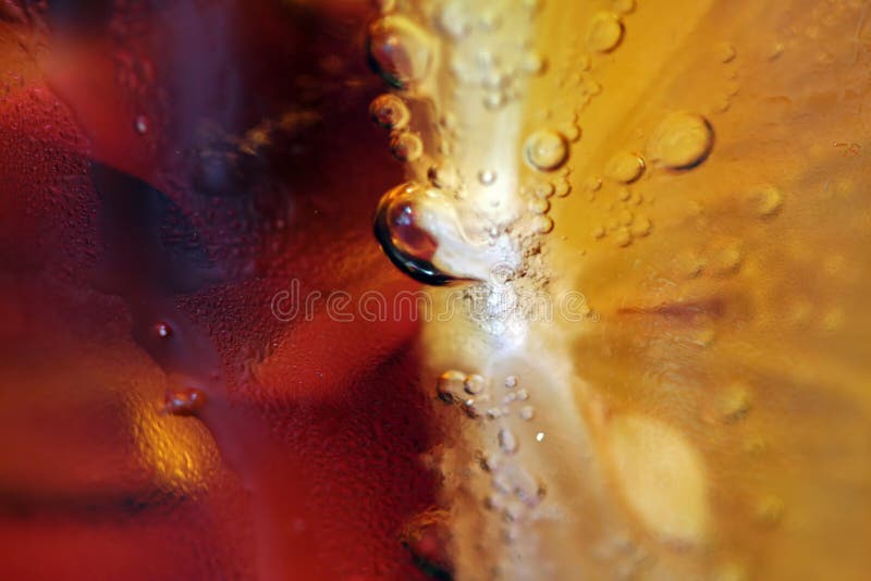 Iced drink with lemon close up