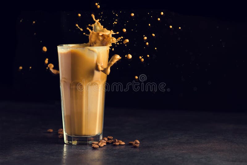 Iced latte coffee glass with splash