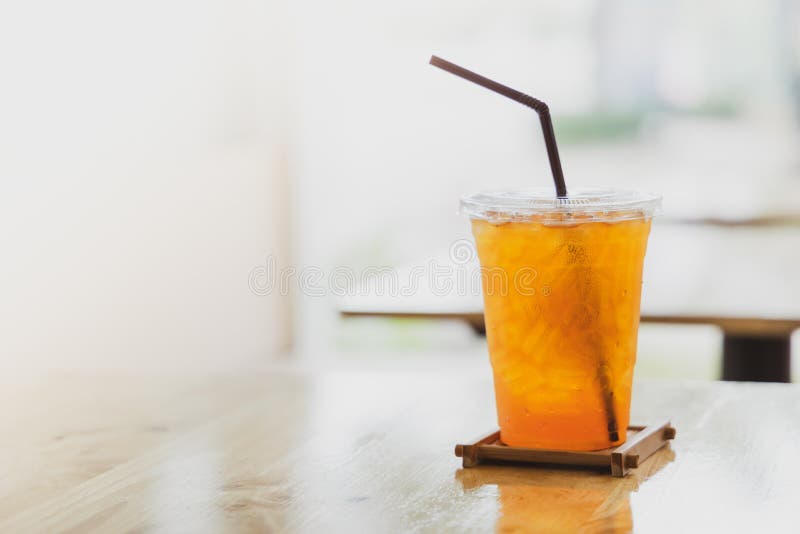 https://thumbs.dreamstime.com/b/iced-lemon-tea-plastic-cup-brown-straw-blured-cafe-background-154572144.jpg