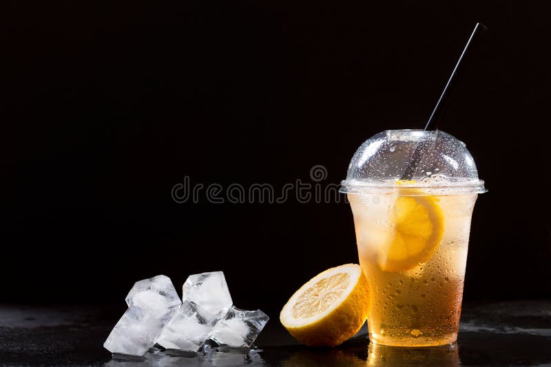 Iced Tea In Plastic Cup With Lemon And Mint Stock Photo, Picture