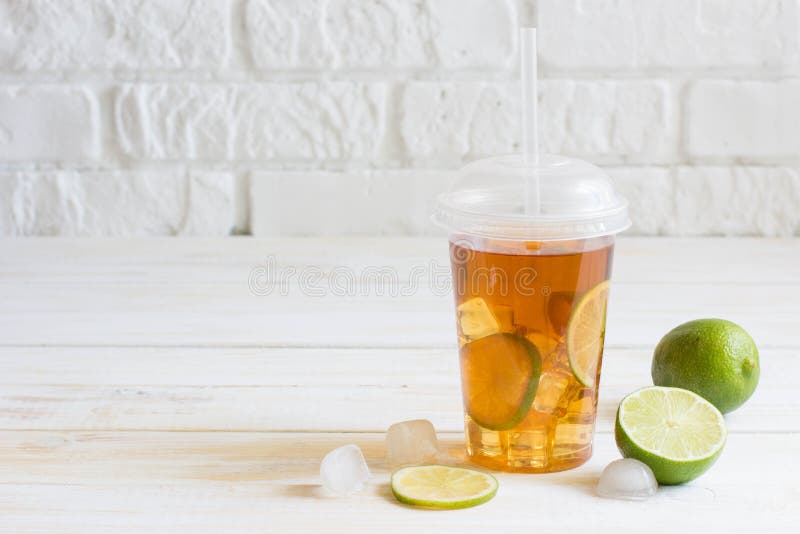 Fresh ice tea in plastic cup Stock Photo - Alamy