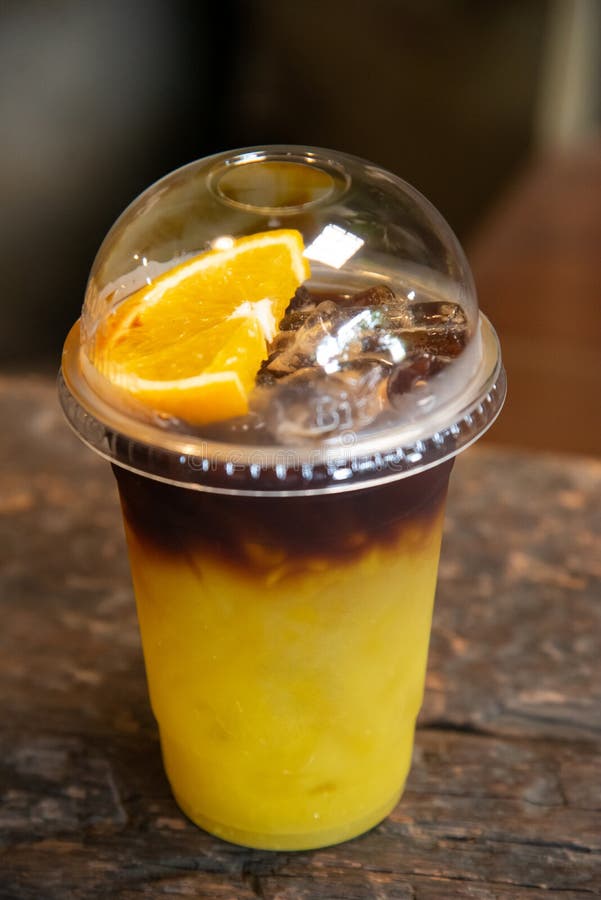 Iced Yuzu Orange Juice Infused with Espresso Coffee Decorating with