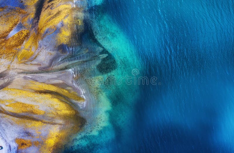 Iceland. Aerial view on the coast line. Beach and sea from air. Famous place in Iceland. Summer seascape from drone.