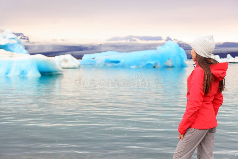 Iceland glacial lagoon - woman looking at view