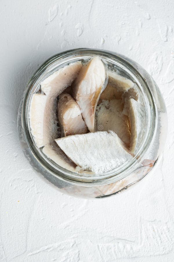 Icelandic Herring, in Glass Jar, on White Background, Top View Flat Lay