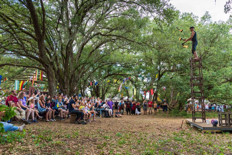 Ichabod Wainwright Juggles Flaming Axes while Standing on Stacked