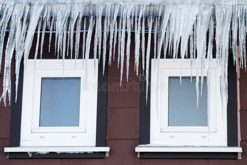 Icicles in front of two windows