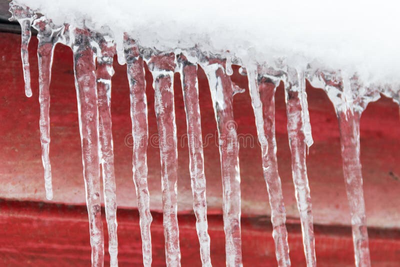 Icicles hanging from roof stock image. Image of light 126912573