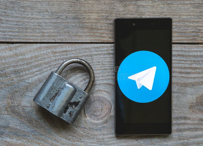 Icon of the Telegram messenger on the smartphone screen with a lock and a key