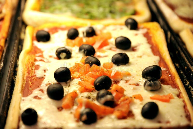 Iconic Italian food: pizza with black olives stock photography Iconic Italian food: pizza with black olives stock photography