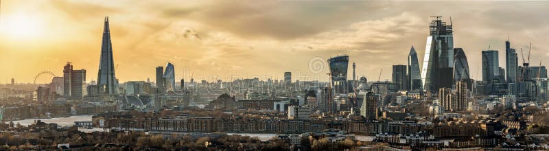 The iconic skyline of London, UK, during sunset: from the City to the Tower Bridge