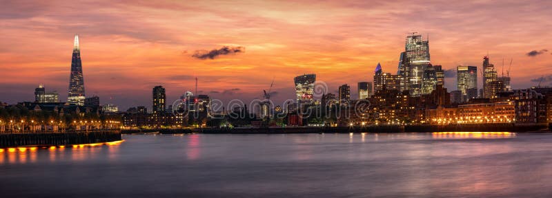The iconic urban skyline of London, UK, after sunset time stock photo The iconic urban skyline of London, UK, after sunset time stock photo
