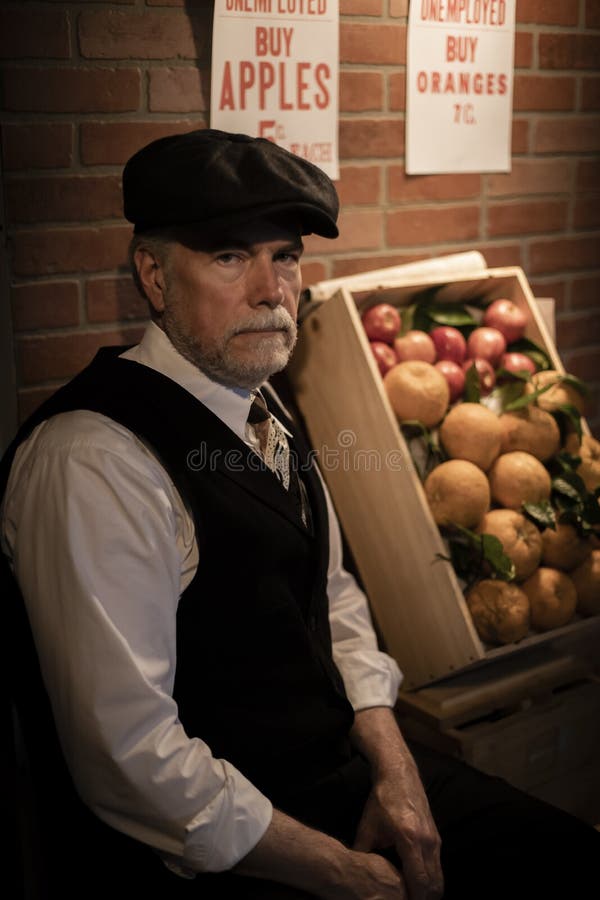 Iconic well dressed unemployed man during the Great Depression referred to as an apple hawker