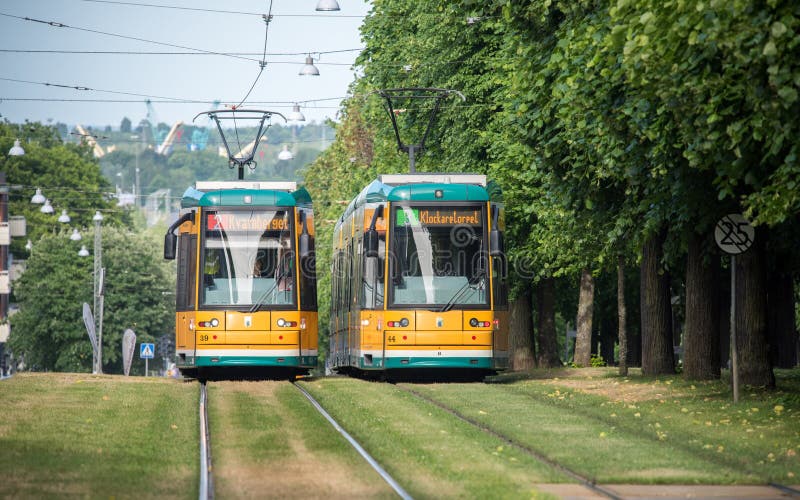 Norrkoping, Sweden - June 19, 2016: The iconic yellow trams of Norrkoping. Norrkoping is a historic industrial town in Sweden. Norrkoping, Sweden - June 19, 2016: The iconic yellow trams of Norrkoping. Norrkoping is a historic industrial town in Sweden.