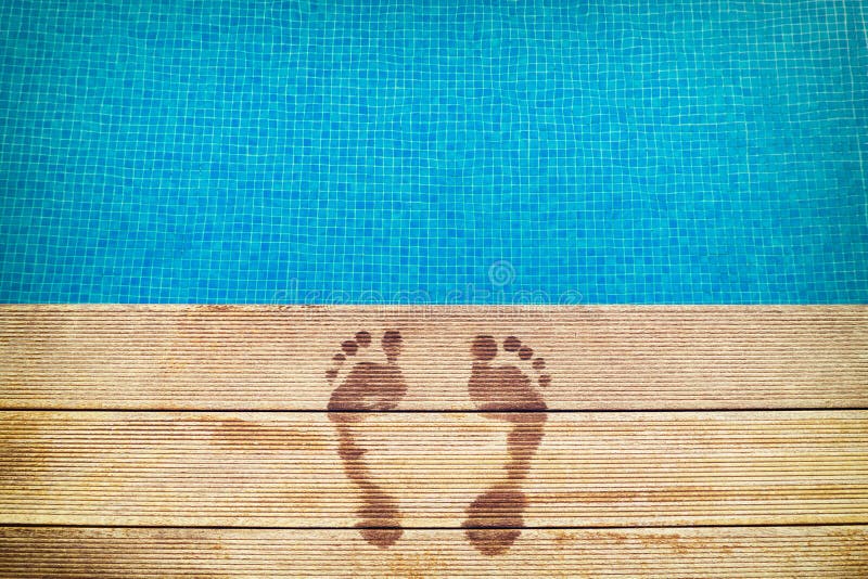 :icture of footprints on the wooden surface with blue swimming pool on the background royalty free stock images :icture of footprints on the wooden surface with blue swimming pool on the background royalty free stock images
