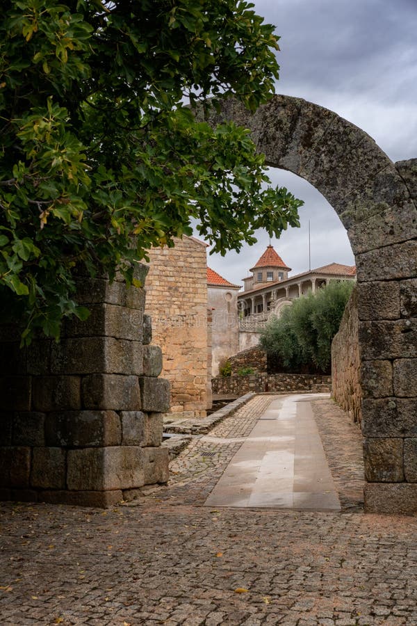 Idanha a velha castle wall entrance with cathedral church on the background, in Portugal