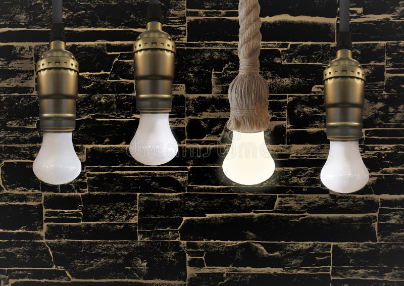 Idea Concept with Light Bulb or Hanging Light Bulbs with Glowing One