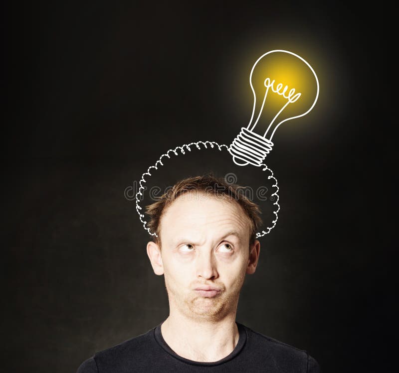 Idea concept. Man thinking on blackboard background with light bulb. Brainstorm and idea royalty free stock image Idea concept. Man thinking on blackboard background with light bulb. Brainstorm and idea royalty free stock image