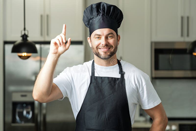 Idea For Food Portrait Of Chef Man In A Chef Cap In The Kitchen Stock idea-for-food-portrait-of-chef-man-in-a-chef-cap-in-the-kitchen-stock