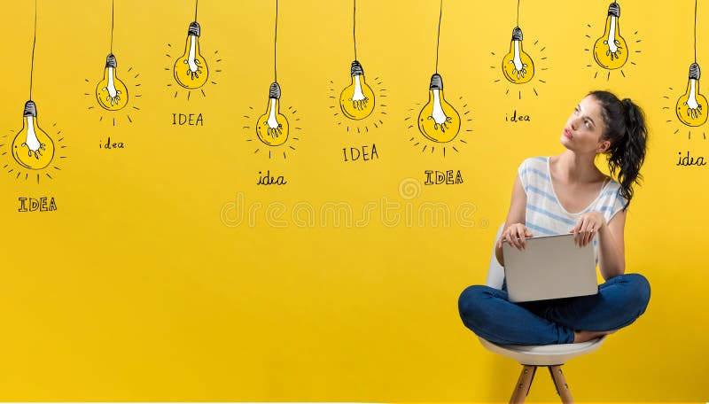 Idea light bulbs with woman using a laptop stock photo Idea light bulbs with woman using a laptop stock photo