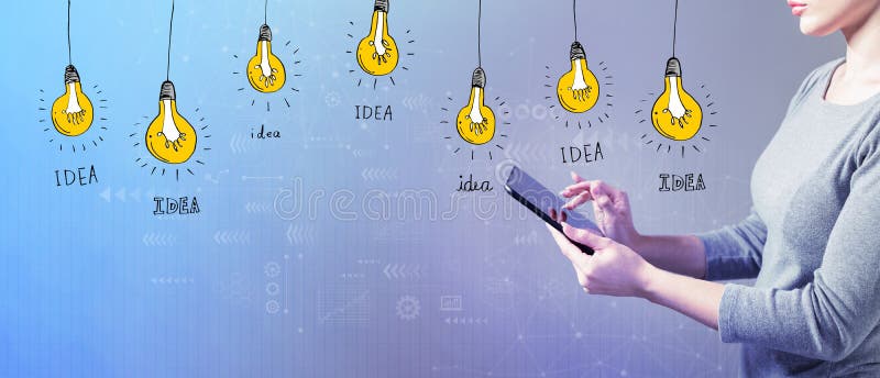 Idea light bulbs with woman using a tablet royalty free stock photography Idea light bulbs with woman using a tablet royalty free stock photography
