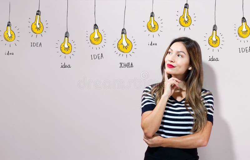 Idea light bulbs with young businesswoman royalty free stock image Idea light bulbs with young businesswoman royalty free stock image