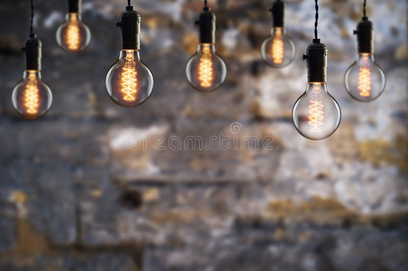 Idea and teamwork concept Vintage bulbs on wall background royalty free stock image